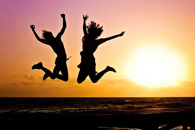 2 women jumping